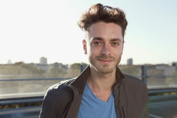 Young man looking into camera